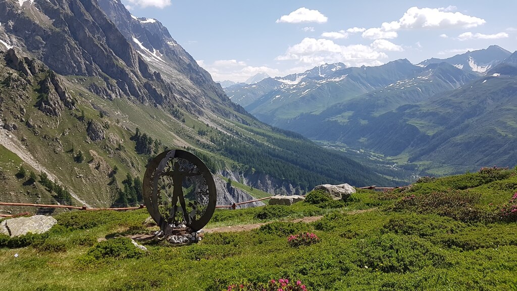 Views from the  Saussurea alpine botanical gardens down to Val Ferret in the Summer with a Sculpture in view